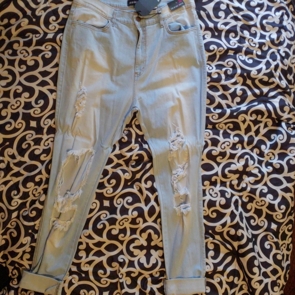 Light blue cut up jeans